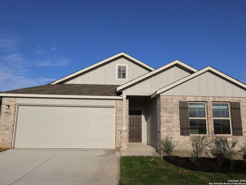 Front exterior of a new home in Greenspoint Heights, Seguin, TX, highlighting curb appeal (Image 20).