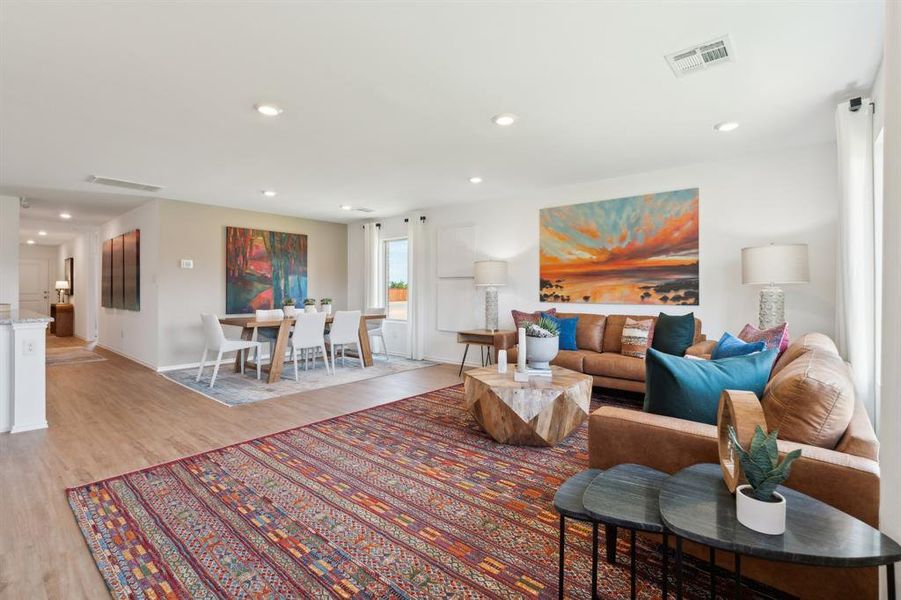 Living room with light wood-type flooring