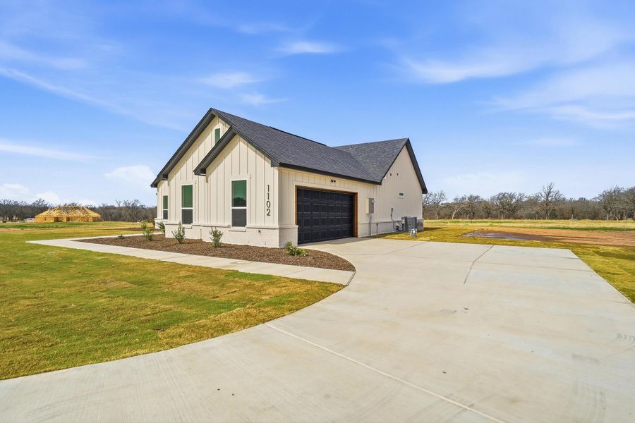 Front exterior of a new home in Taylor Ranch, Springtown, TX, highlighting curb appeal (Image 24).