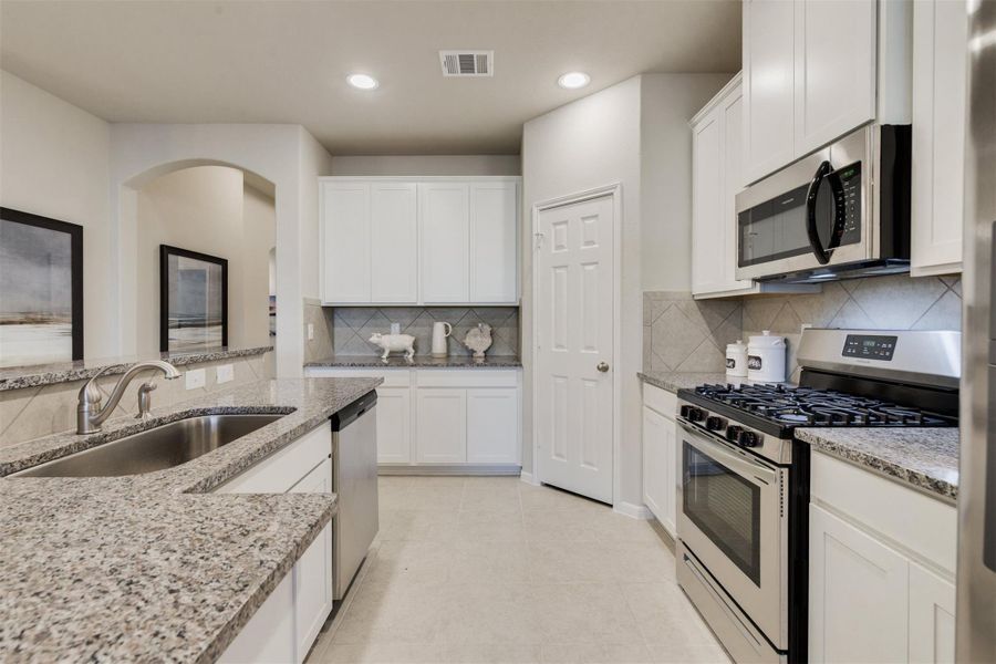 Furnished interior view inside a new home in Sunterra, Katy (Image 22).