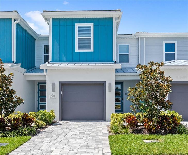 Front exterior of a new home in , Kissimmee, FL, highlighting curb appeal (Image 19).