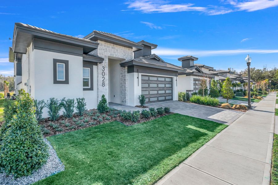 Representative exterior photo of a completed home built from the Courtyard 50 by ABD Development in Hampton Green at Providence, Davenport, FL (Image 31).