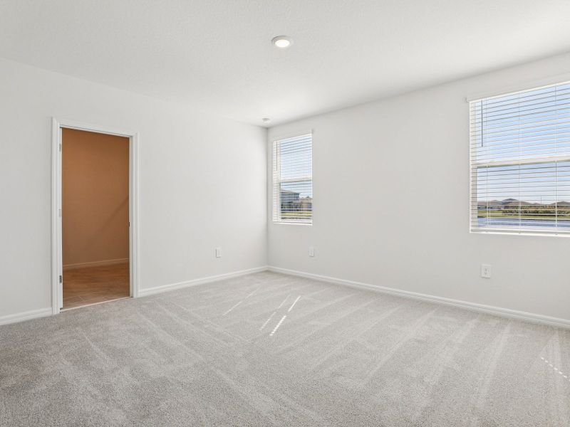 Spacious, unfurnished interior of a new home in Lake Deer Estates - Signature Series, Poinciana (Image 11).