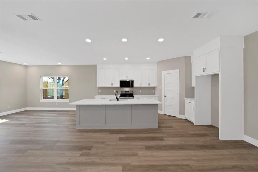 Furnished interior view inside a new home in , The Colony (Image 5).