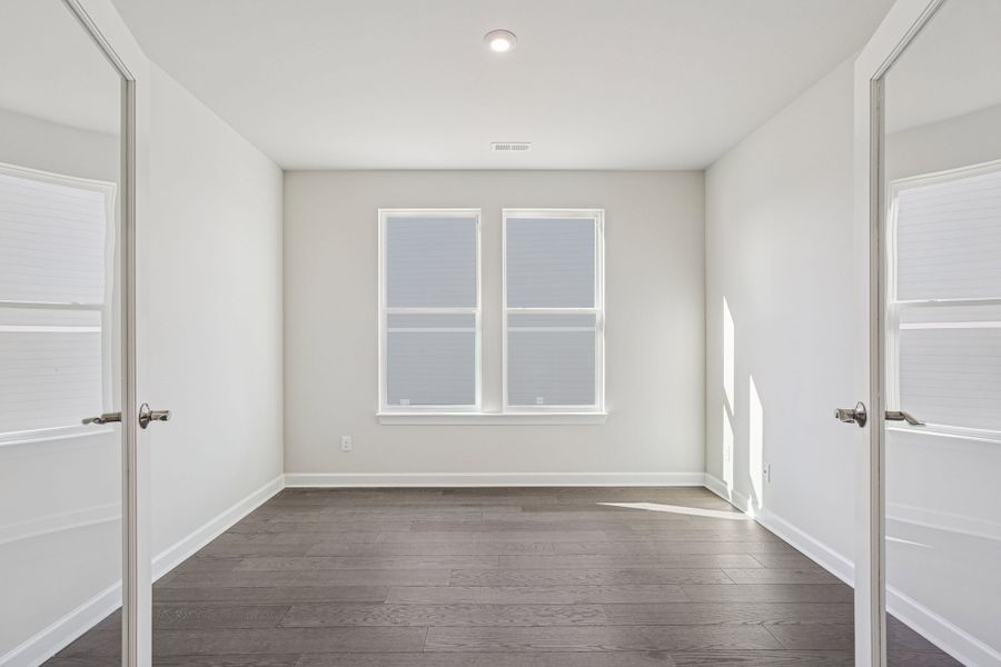 Spacious, unfurnished interior of a new home in Altis At Serenity | A 55+ Community, Fuquay Varina (Image 14).