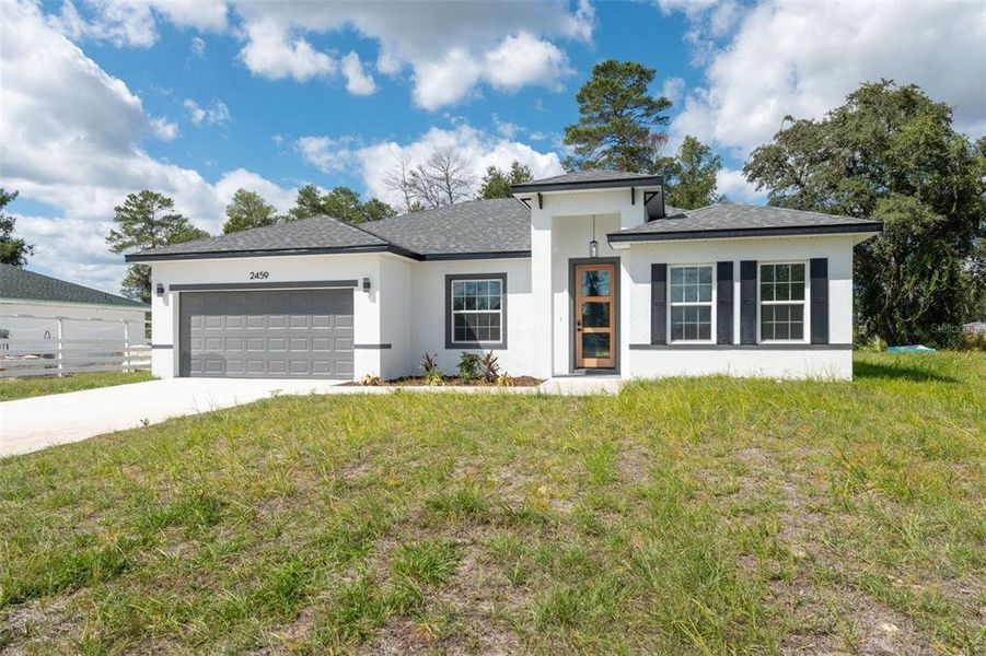 Front exterior of a new home in , Ocala, FL, highlighting curb appeal (Image 19). Front exterior of a new home in , Ocala, FL, highlighting curb appeal (Image 19).