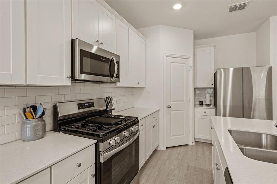 Furnished interior view inside a new home in Hurricane Creek: Classic 60s, Anna (Image 17). Furnished interior view inside a new home in Hurricane Creek: Classic 60s, Anna (Image 17).