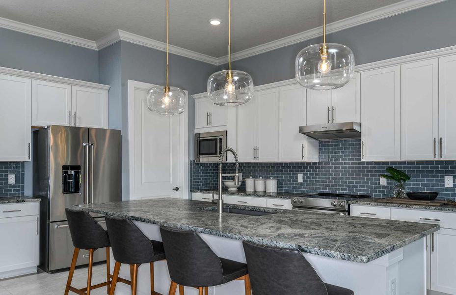 Open Kitchen with Island, Generous Counter Space and Stainless Steel Appliances