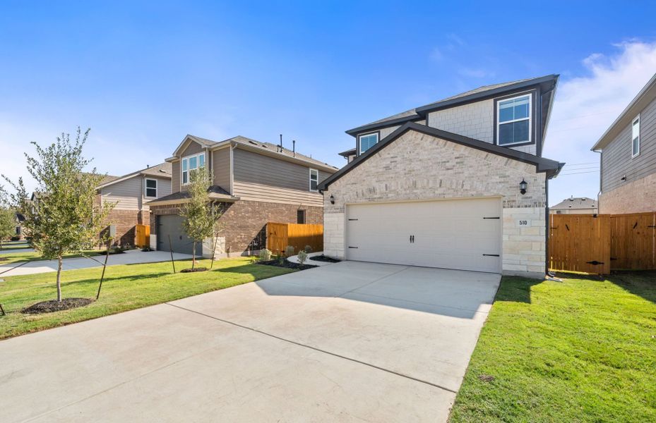 Front exterior of a new home in Crosswinds, Kyle, TX, highlighting curb appeal (Image 20).