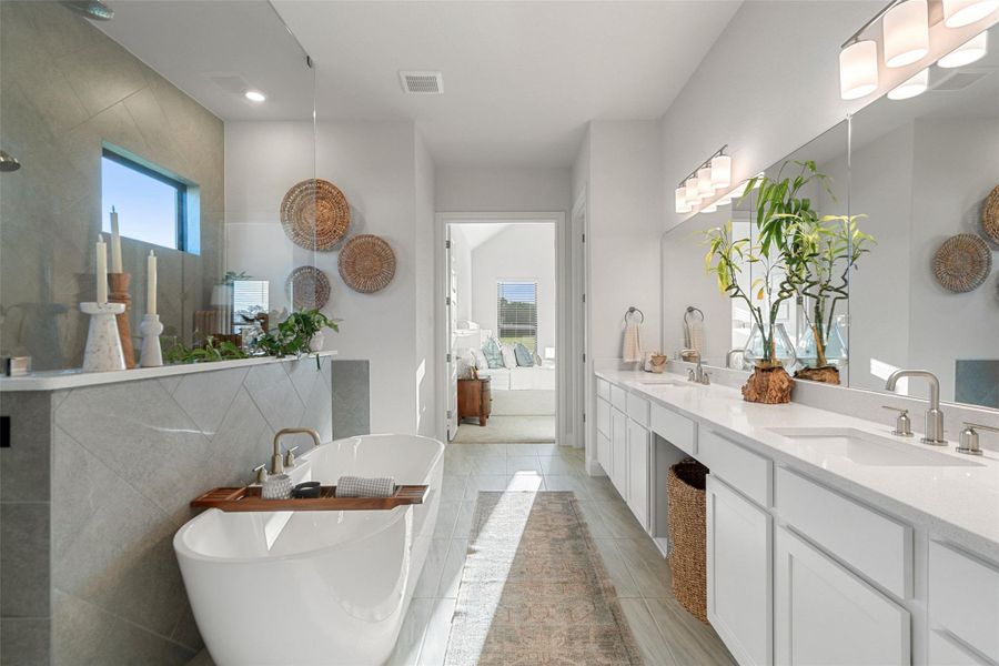 Luxurious bathroom retreat with dual vanities, a spacious soaking tub, and elegant tile work. Luxurious bathroom retreat with dual vanities, a spacious soaking tub, and elegant tile work.