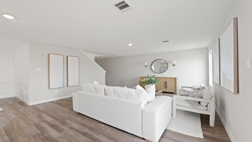Representative furnished interior of a home built from the Franklin by D.R. Horton in Silverthorne, Conroe (Image 8).