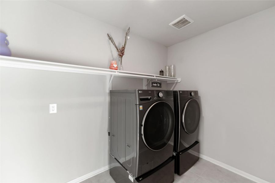 Utility room located just off the garage makes chores simple and efficient. Utility room located just off the garage makes chores simple and efficient.