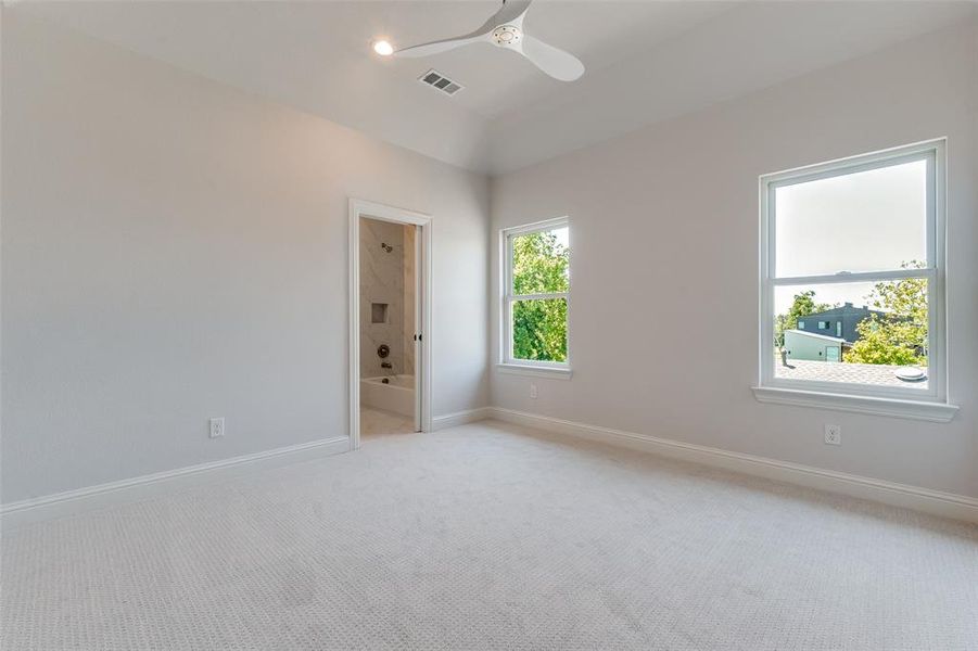 Carpeted spare room featuring ceiling fan and recessed lighting Carpeted spare room featuring ceiling fan and recessed lighting