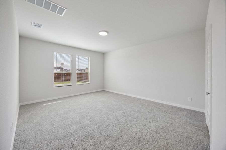 Primary Suite in the Masters home plan by Trophy Signature Homes – REPRESENTATIVE PHOTO