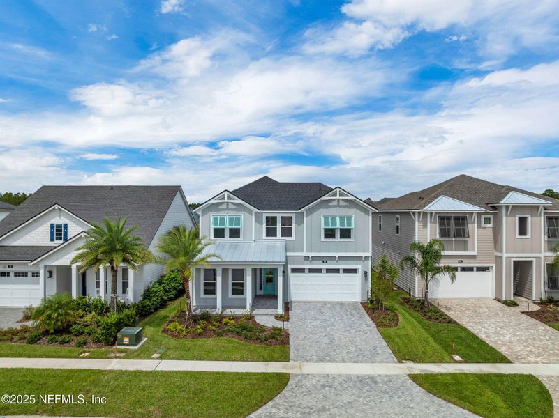 Front exterior of a new home in Seabrook Village at Seabrook, Ponte Vedra, FL, highlighting curb appeal (Image 27).