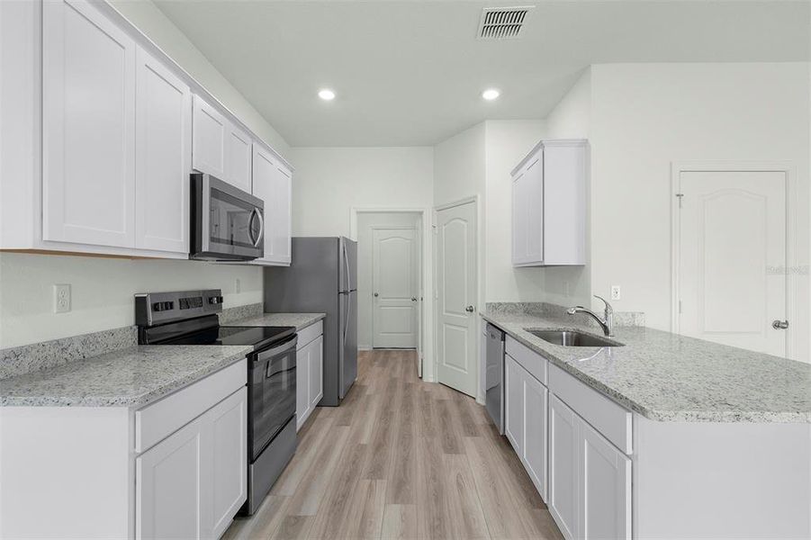 Furnished interior view inside a new home in Tula Parc, Astatula (Image 7).