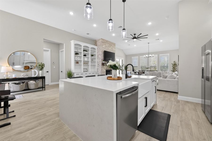 Kitchen view overlooking living and dining spaces. Kitchen view overlooking living and dining spaces.