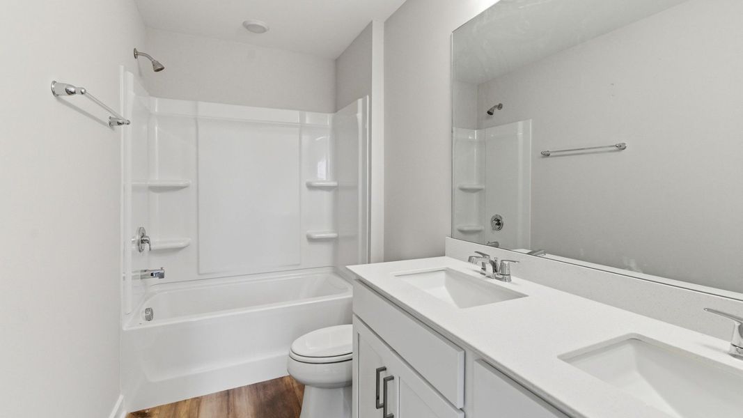 Bathroom with hard surface flooring and dual vanity Bathroom with hard surface flooring and dual vanity