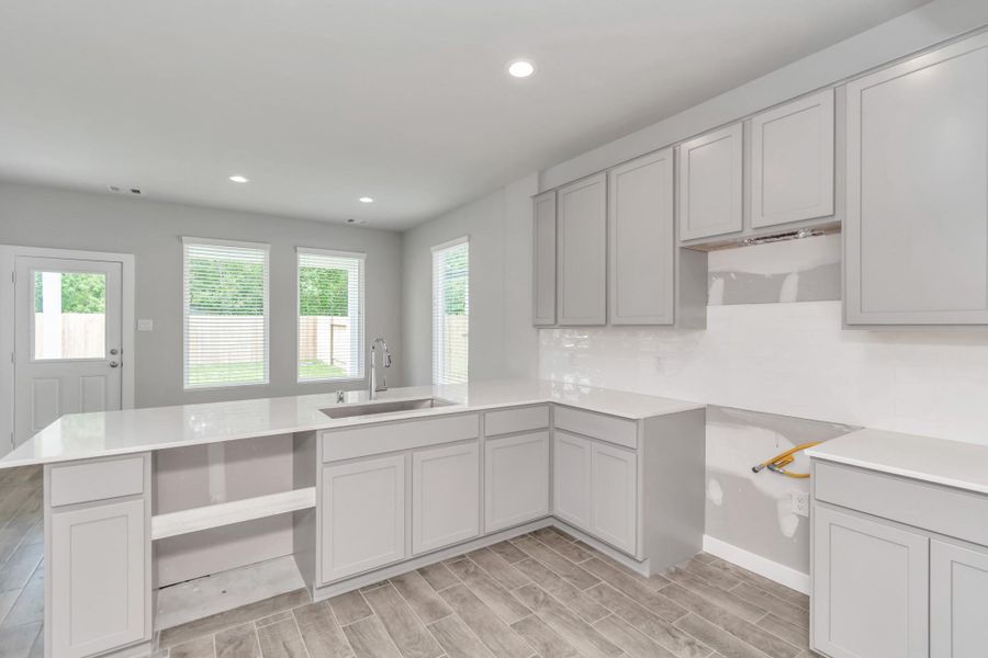 This generously spacious kitchen is a dream realized! Sample photo of completed home with similar floor plan. Actual colors and selections may vary.