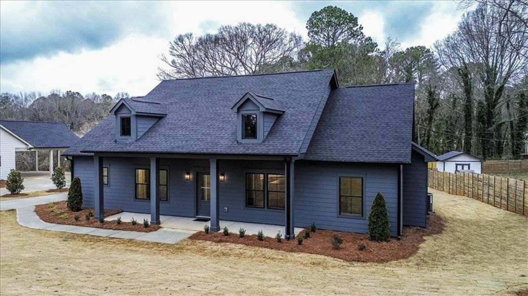 Front exterior of a new home in , Monroe, GA, highlighting curb appeal (Image 24).