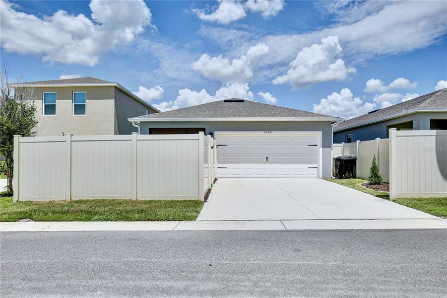 Front exterior of a new home in Windrose, Apopka, FL, highlighting curb appeal (Image 21).