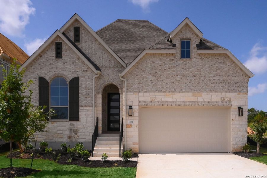Front exterior of a new home in Mayfair, New Braunfels, TX, highlighting curb appeal (Image 1). Front exterior of a new home in Mayfair, New Braunfels, TX, highlighting curb appeal (Image 1).