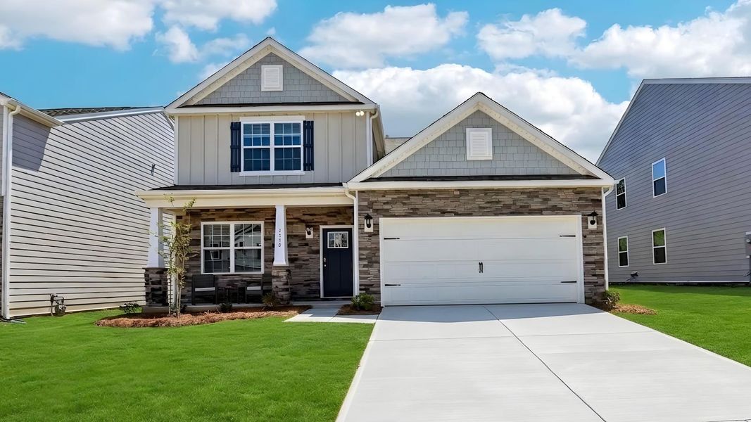 Front exterior of a new home in Secrest Commons, Monroe, NC, highlighting curb appeal (Image 1). Front exterior of a new home in Secrest Commons, Monroe, NC, highlighting curb appeal (Image 1).