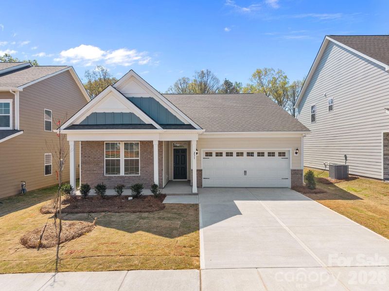 Front exterior of a new home in McFarland Estates, York, SC, highlighting curb appeal (Image 2). Front exterior of a new home in McFarland Estates, York, SC, highlighting curb appeal (Image 2).