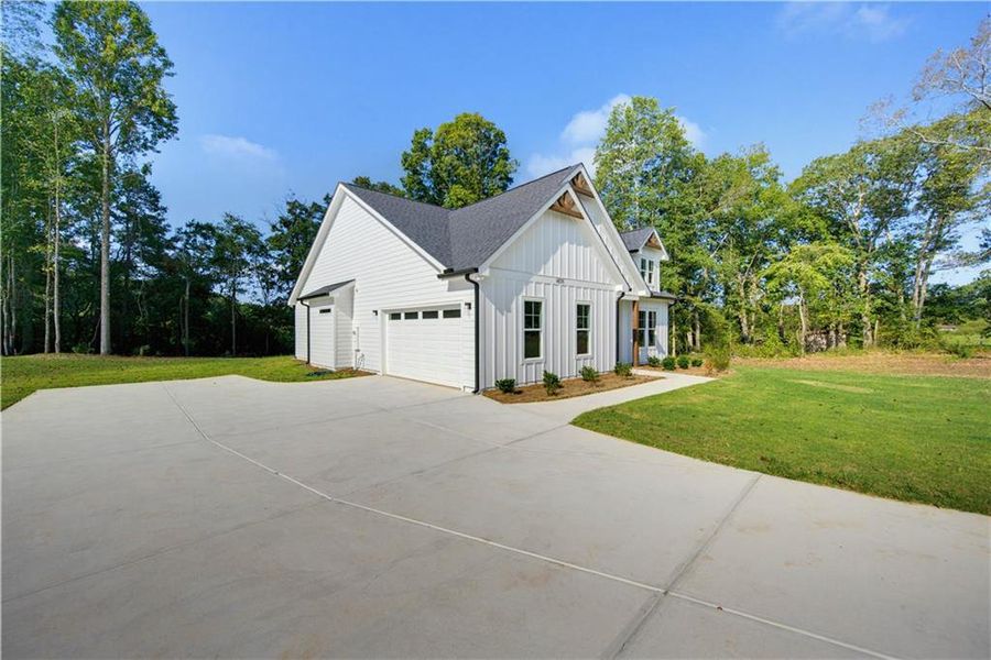 Front exterior of a new home in , Gainesville, GA, highlighting curb appeal (Image 23). Front exterior of a new home in , Gainesville, GA, highlighting curb appeal (Image 23).