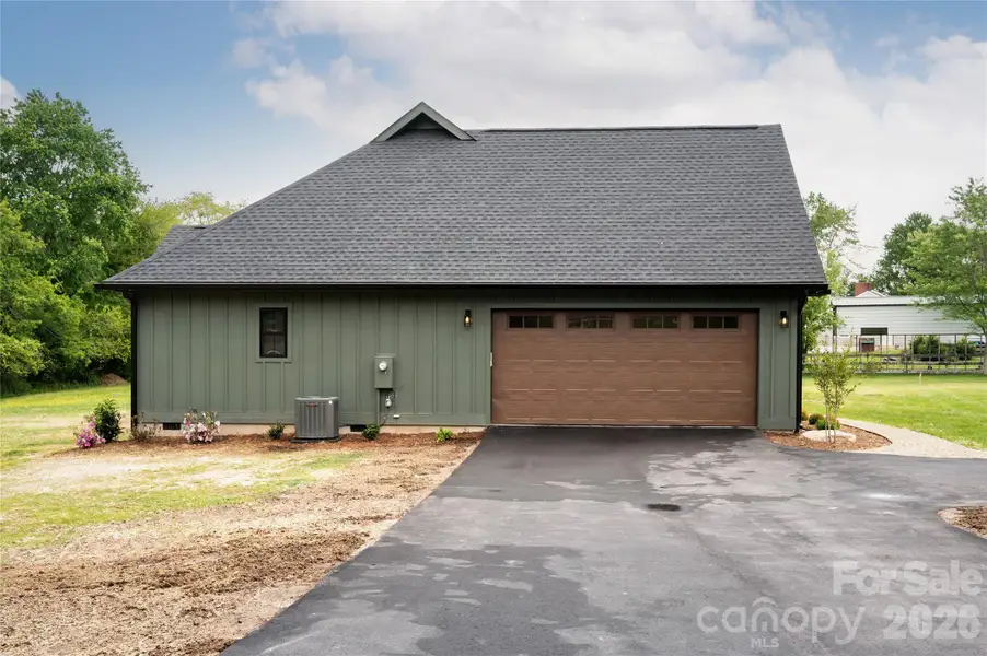 Exterior details and patio area of a home in , Mills River (Image 27).