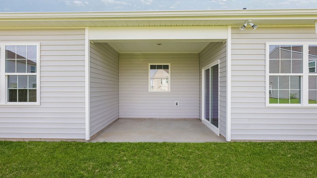 Exterior details and patio area of a home in Tyler - Home on the Lake, New Bern (Image 3).
