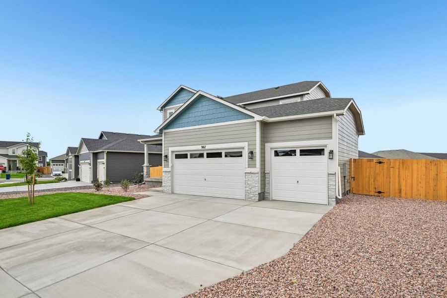Front exterior of a new home in The Glen, Colorado Springs, CO, highlighting curb appeal (Image 2). Front exterior of a new home in The Glen, Colorado Springs, CO, highlighting curb appeal (Image 2).