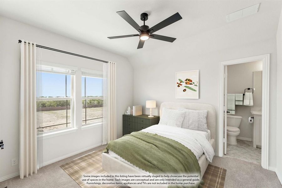 Bedroom with vaulted ceiling, ceiling fan, carpet flooring, and attached bathroom visible through doorway