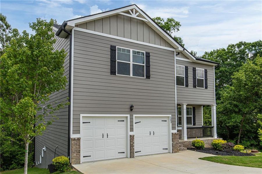 Front exterior of a new home in The Villages at Oakshire, Atlanta, GA, highlighting curb appeal (Image 2). Front exterior of a new home in The Villages at Oakshire, Atlanta, GA, highlighting curb appeal (Image 2).