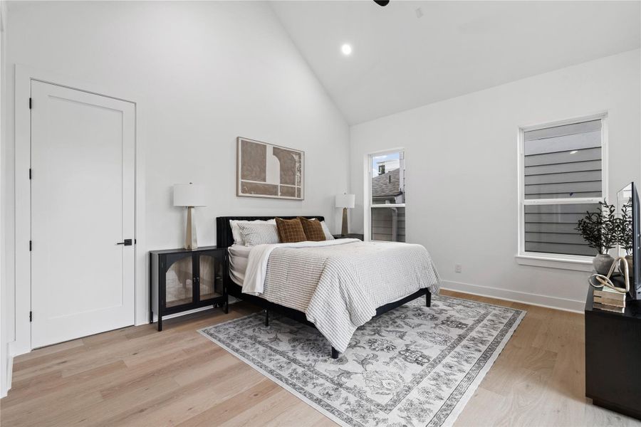 Composed beneath a vaulted ceiling, the primary suite reads like a quiet gallery—clean wall planes, discreet recessed lighting, and solid-core doors that heighten privacy. A short vestibule leads to a spa-level bath and custom wardrobe, while zoned, high-efficiency HVAC keeps the retreat hushed and perfectly tempered. Subtle, serene, and meticulously resolved.