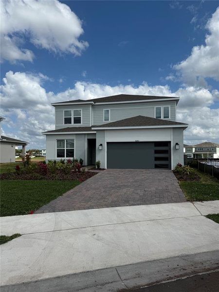 Front exterior of a new home in , Orlando, FL, highlighting curb appeal (Image 1). Front exterior of a new home in , Orlando, FL, highlighting curb appeal (Image 1).