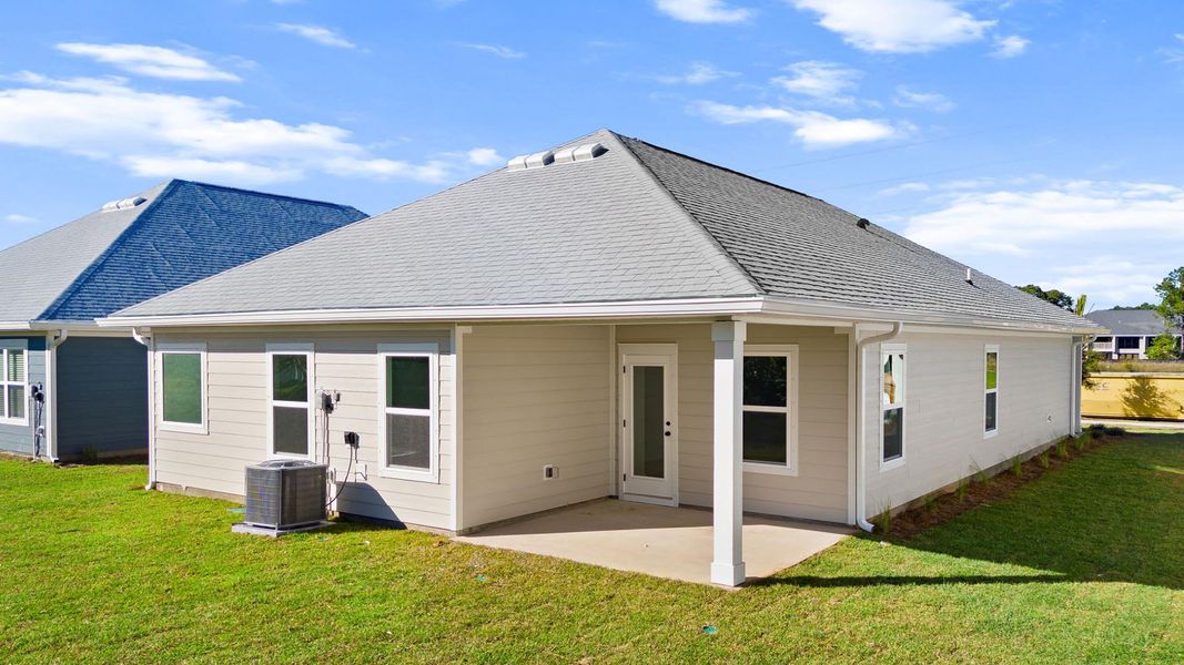 Exterior details and patio area of a home in Caballeros Estates At Hombre, Panama City Beach (Image 4).