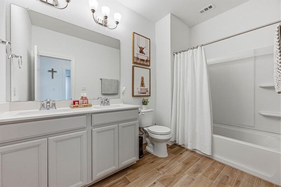 Furnished interior view inside a new home in West Cypress Hills, Spicewood (Image 22).