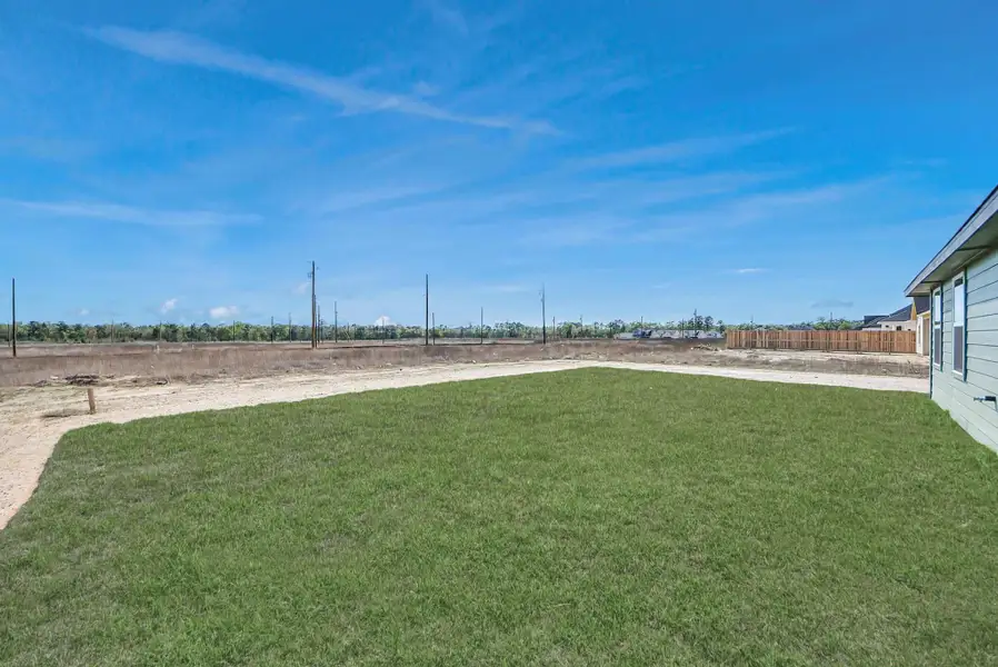 Exterior details and patio area of a home in Hill & Dale Ranch, Splendora (Image 4).