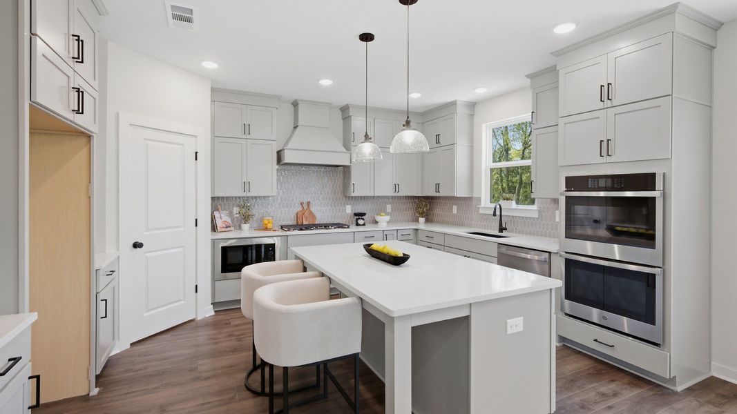 Oven across from kitchen island