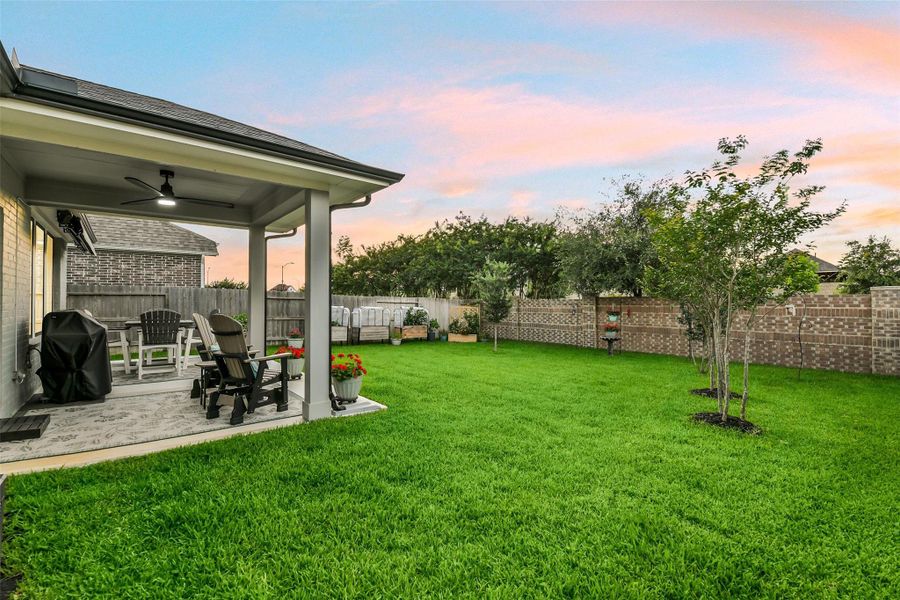 Added trees provide shade and ambiance for this beautiful yard with no back neighbors.