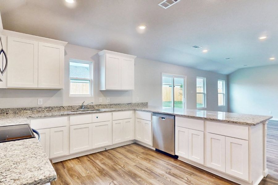 A kitchen with white cabinets. A kitchen with white cabinets.