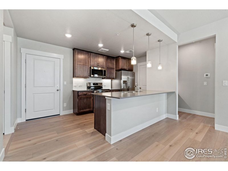 Furnished interior view inside a new home in The Lakes at Centerra - North Shore Flats, Loveland (Image 7).