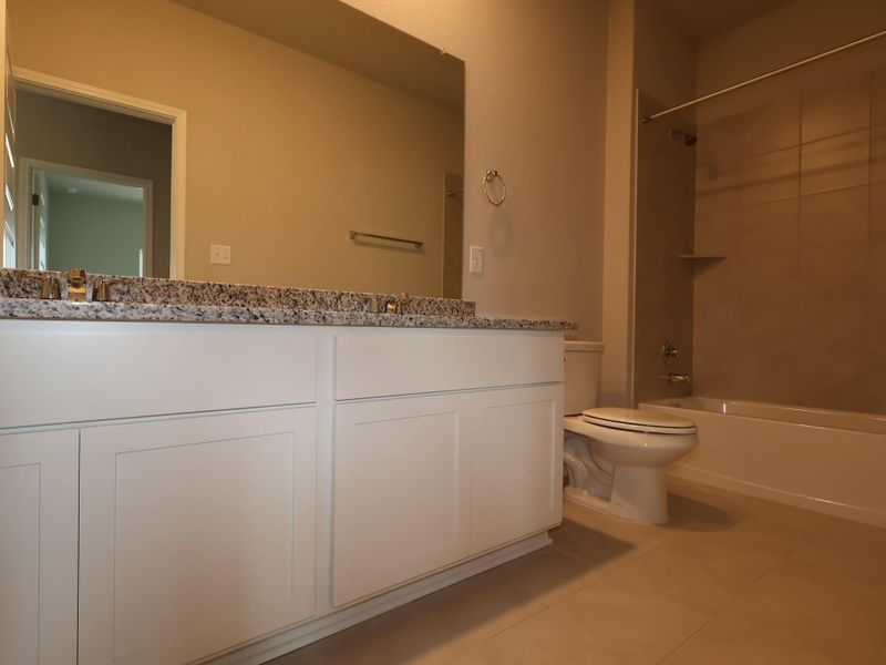 Furnished interior view inside a new home in Carillon, Manor (Image 5).