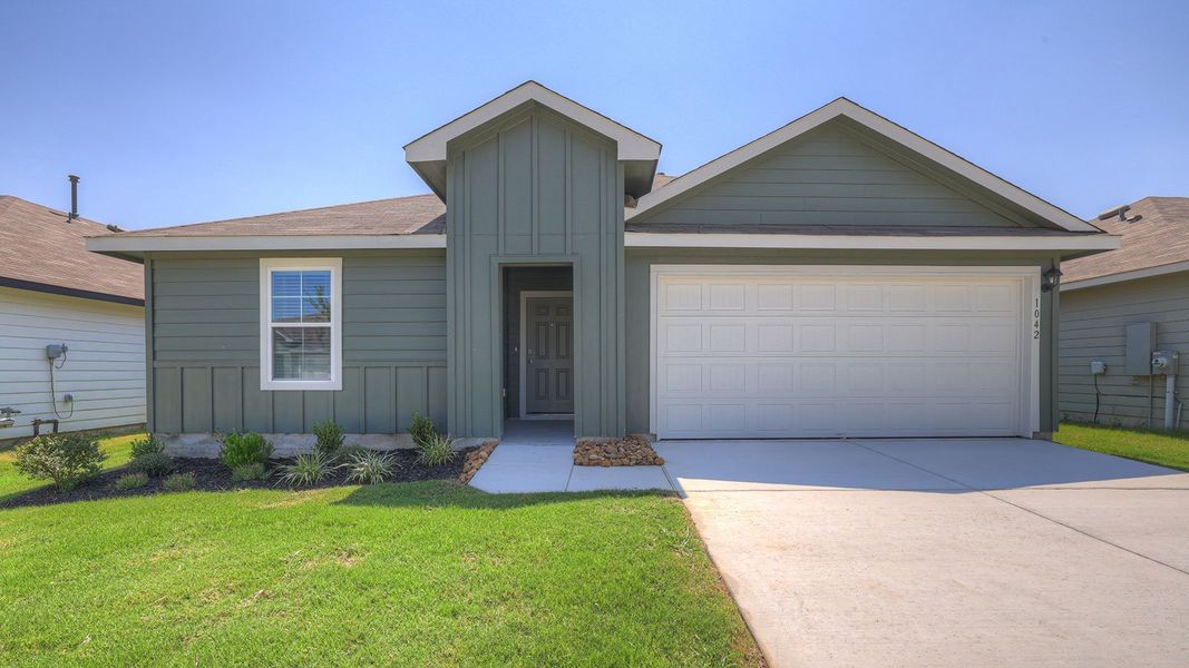 Front exterior of a new home in Navarro Fields, Seguin, TX, highlighting curb appeal (Image 1). Front exterior of a new home in Navarro Fields, Seguin, TX, highlighting curb appeal (Image 1).