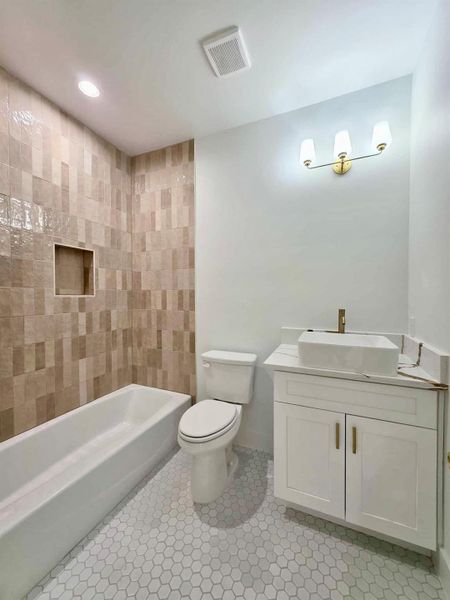 Bathroom with vanity, shower / bathtub combination, recessed lighting, and light tile patterned flooring