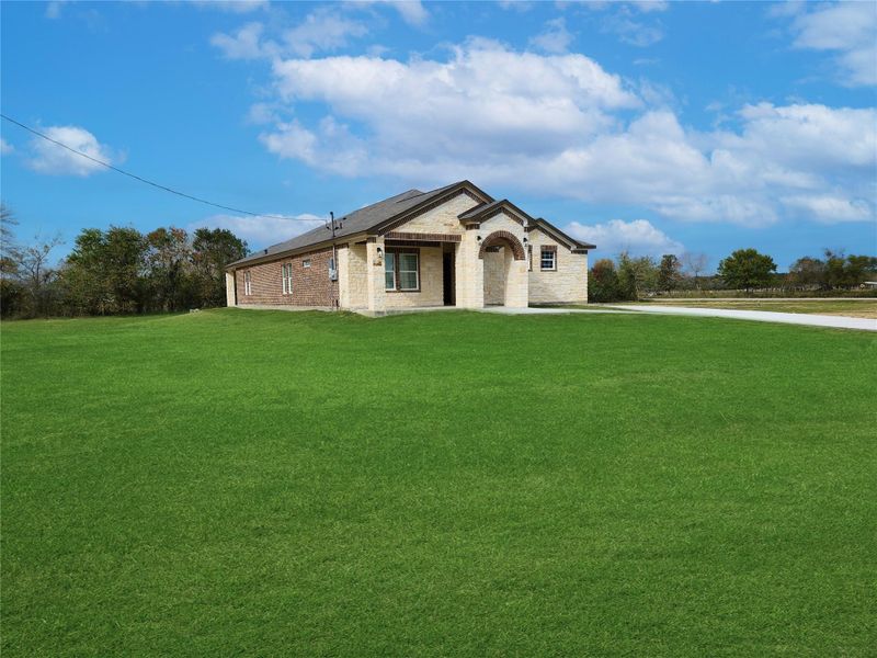 Front exterior of a new home in , Dayton, TX, highlighting curb appeal (Image 18). Front exterior of a new home in , Dayton, TX, highlighting curb appeal (Image 18).