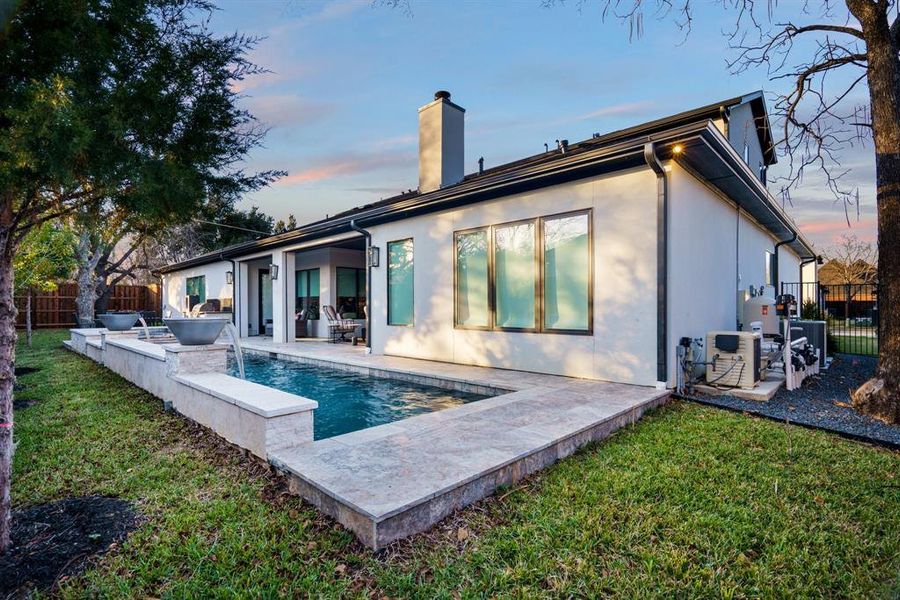 Fenced in pool, pool water feature, a yard, and a patio area