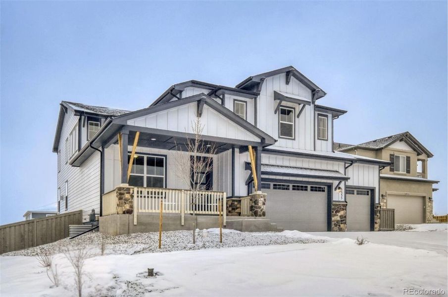 Front exterior of a new home in Sterling Ranch Homestead, Colorado Springs, CO, highlighting curb appeal (Image 2).
