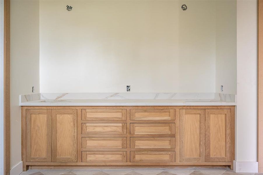 Custom white oak cabinetry in the primary.